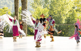 Dancers of Damalahamid on stage at Jacobs Pillow